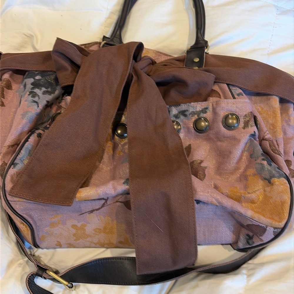 This is the anthropology, deluxe bag, canvas bow floral print